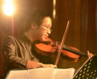 Quanzhi as violinist